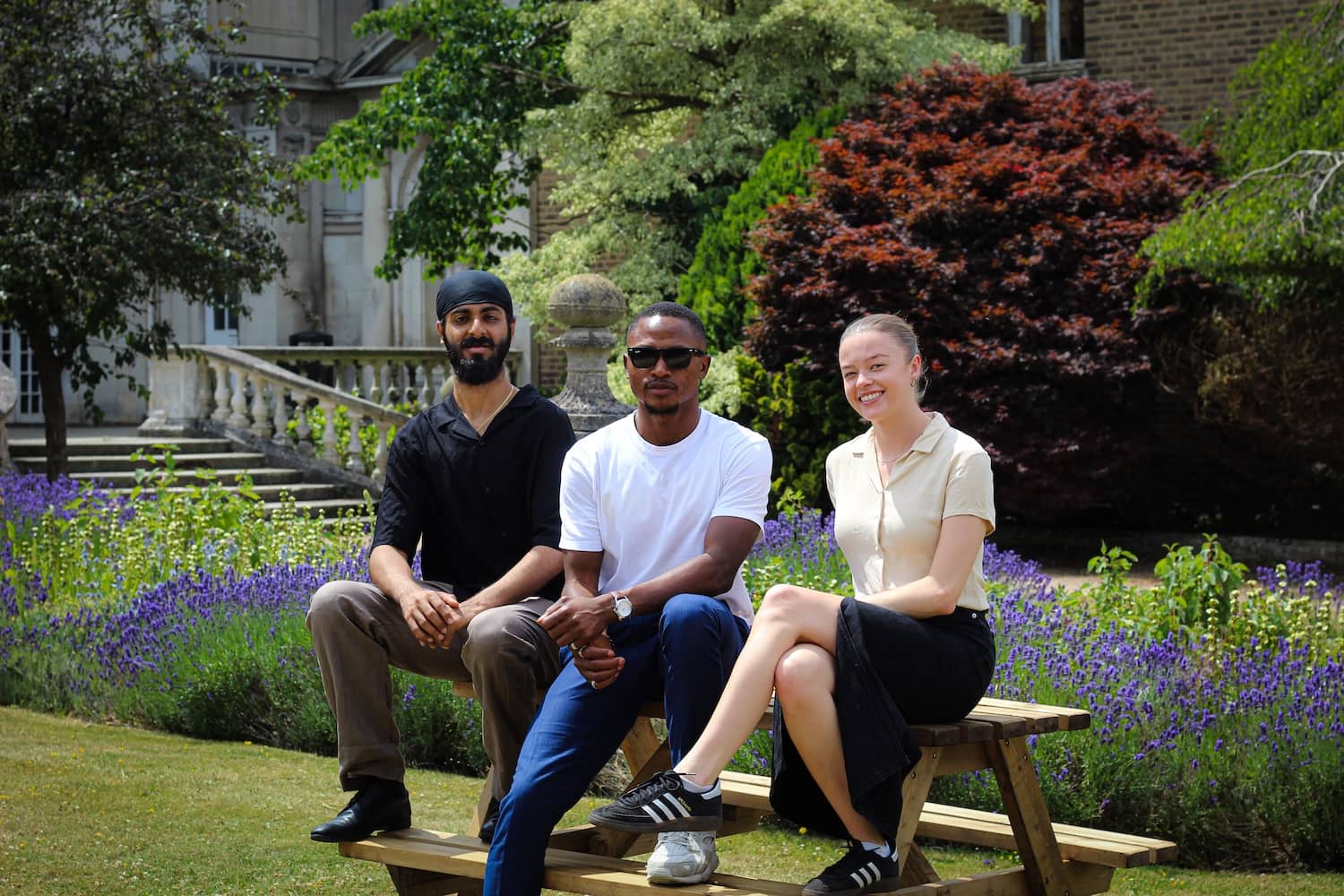RSU officers, Sammy, Joshua and Irene sat on a bench