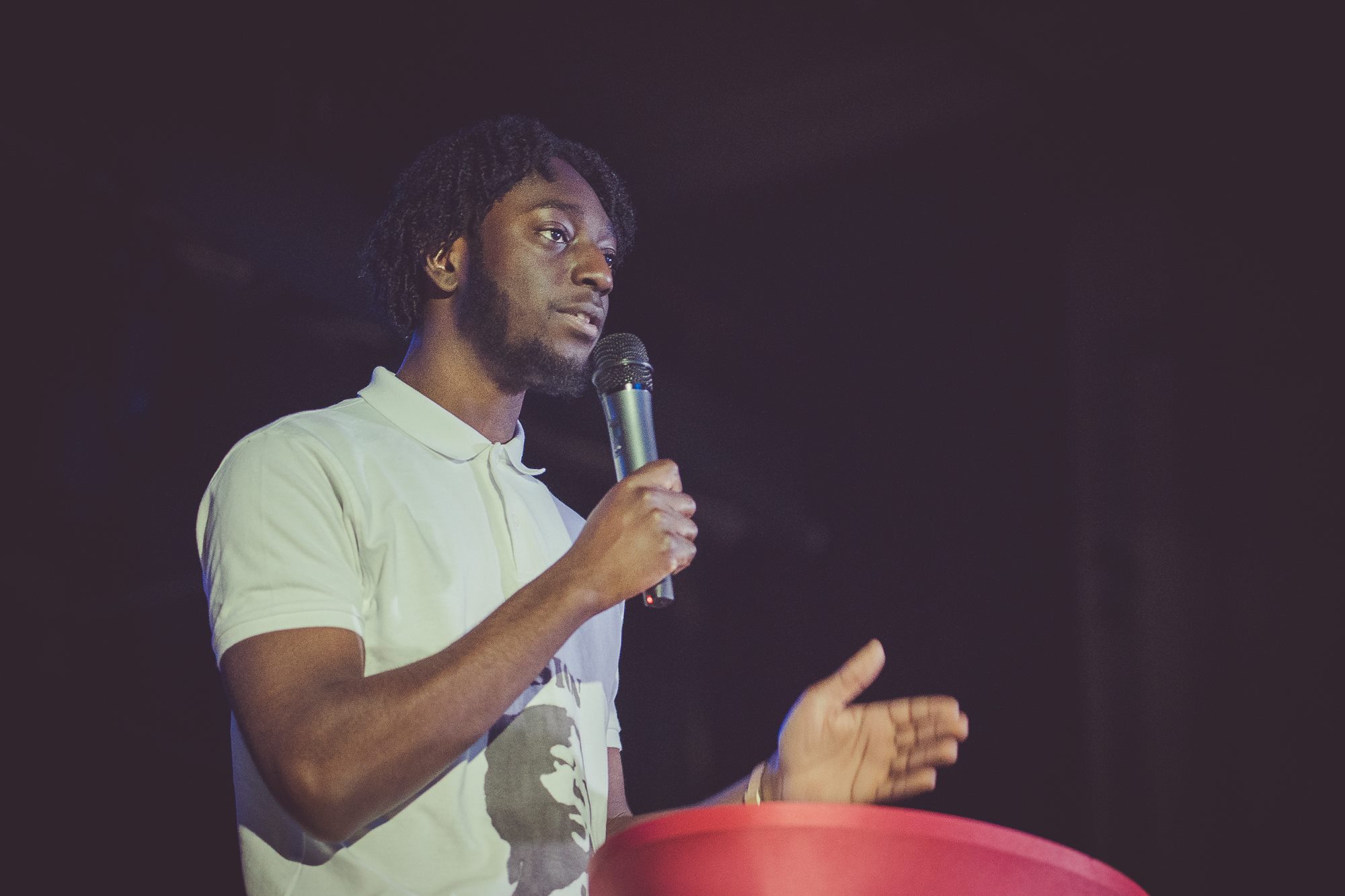 Man speaking into microphone